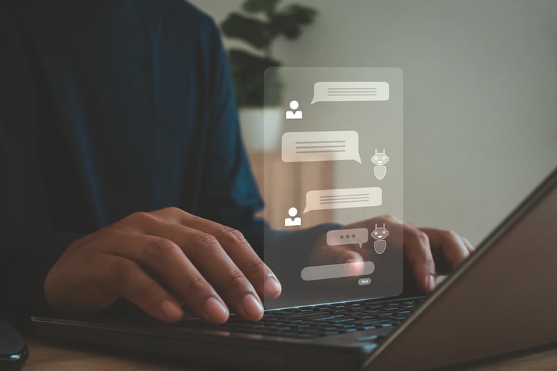 Man using AI-powered chatbot for online customer service support via live chat interface, showcasing CRM software automation and intelligent virtual assistant technology for customer experience optimization